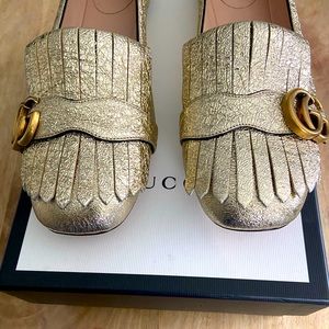Gucci GG Marmont metallic gold flats.